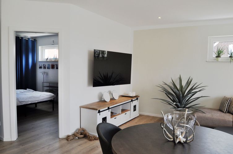Ferienhaus Lieblingsplatz der Wohnbereich mit dem TV